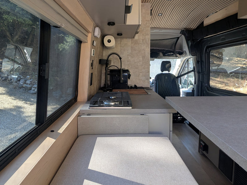  and integrated smart features.|Stylish RV rental interior with a modern kitchen — photo 9