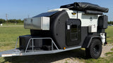 This rugged off-road teardrop **rv rental** is equipped with a solar panel and ready for any adventure.