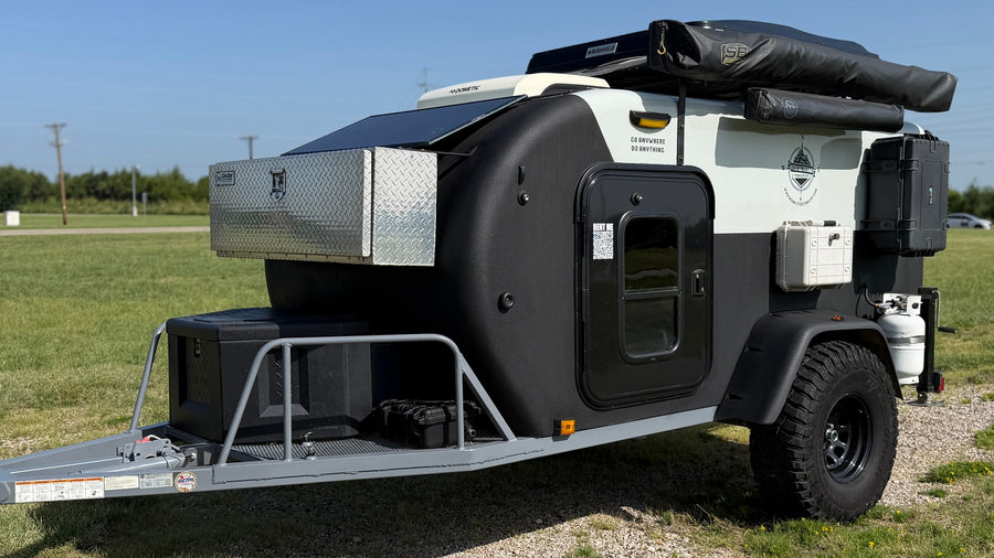 This rugged off-road teardrop **rv rental** is equipped with a solar panel and ready for any adventure.