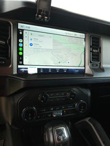 Ford Bronco interior: Android Auto navigation to "Sovereign Van", suggesting an RV rental pickup. Modern infotainment.
