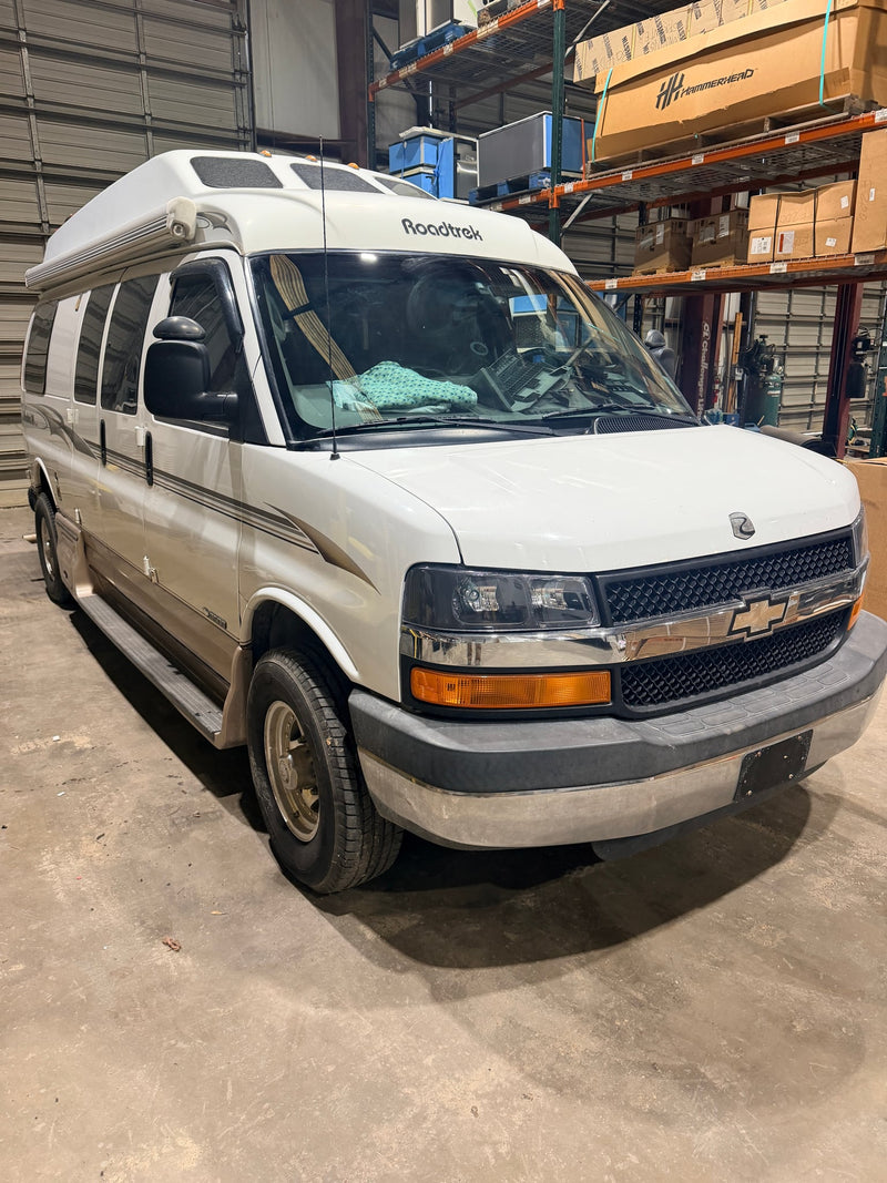  ready for your next road trip adventure.|A white and beige Roadtrek 190 Popular camper van — photo 2