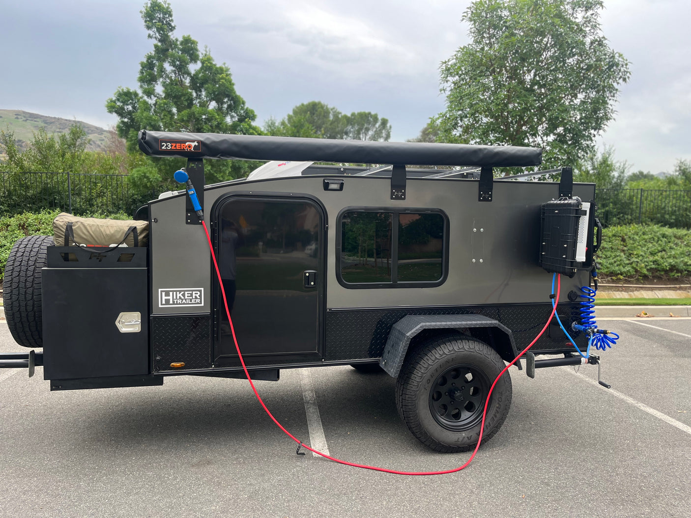 This Hiker Trailer with 23ZERO awning & outdoor shower system, a great compact option for your next rv rental adventure.