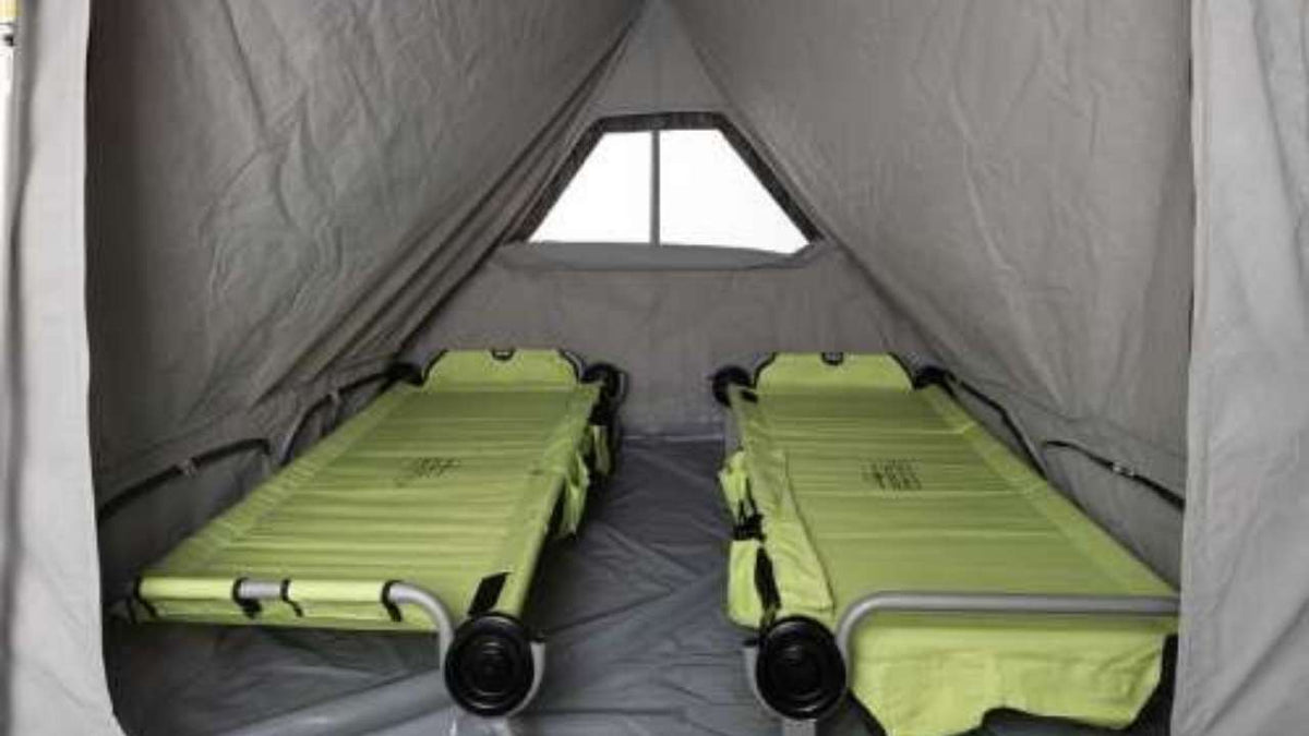  and prep area with fresh vegetables.|Inside an RV rental: a hand plugs a device into USB ports on a control panel — photo 4