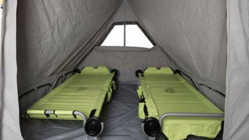  and prep area with fresh vegetables.|Inside an RV rental: a hand plugs a device into USB ports on a control panel — photo 4