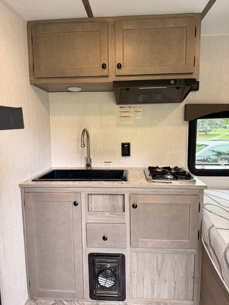  and window view. Ideal for compact camper travel.|Interior of an RV rental: cozy bunk beds — photo 12
