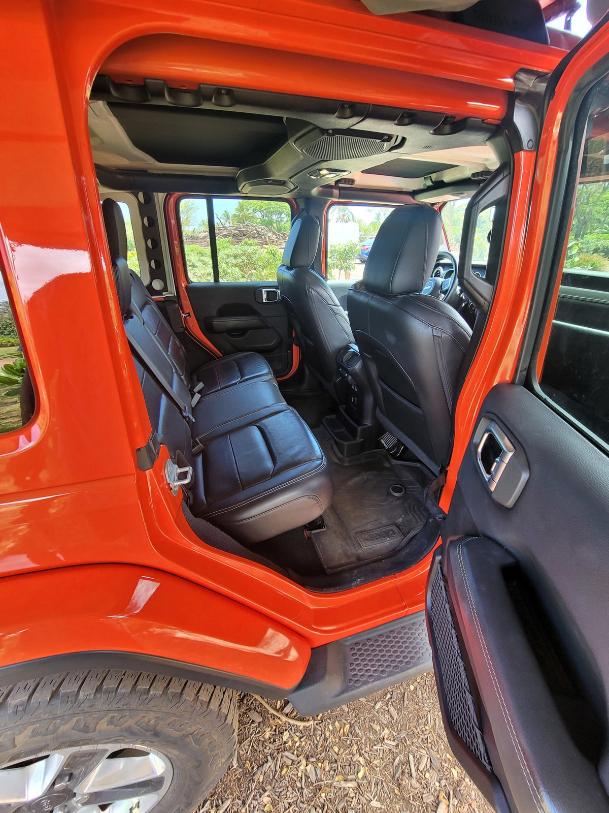 Explore this bright orange Jeep interior, a great option for any RV rental road trip. — photo 5