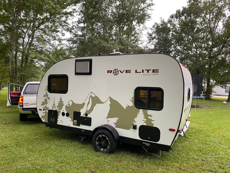 A Rove Lite (Built By TLRV) travel trailer, ideal for an RV rental, is parked on green grass with a truck nearby. — photo 2