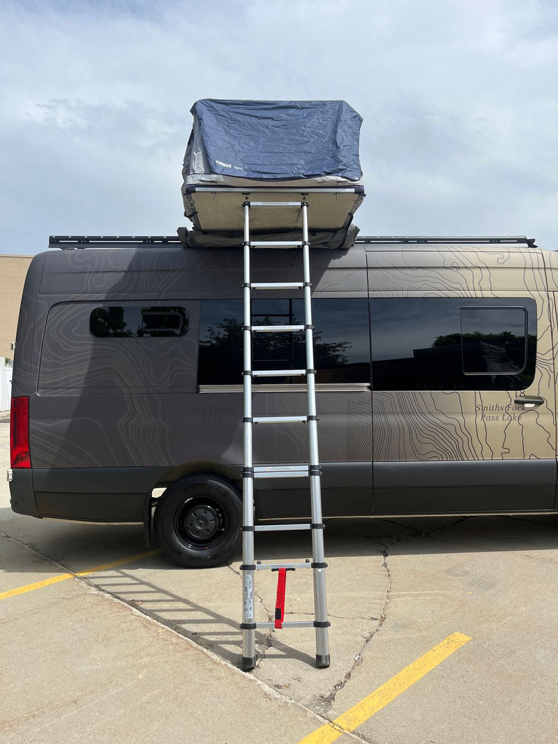  parked. Ideal for RV rental.|Front view of a beige Mercedes-Benz Sprinter van with a topographical map wrap — photo 19