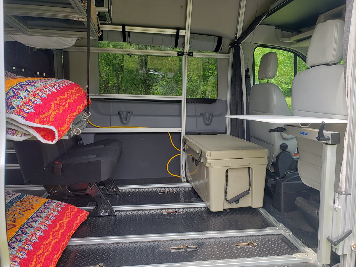  and a sleeping area in a custom van conversion.|Inside a custom RV rental — photo 11