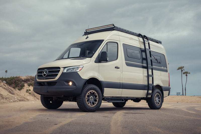Explore with this tan Mercedes Sprinter 4x4 adventure rv rental. Features off-road tires — photo 1