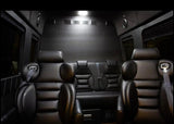 Spacious, dark RV rental interior with plush black leather seats, perfect for luxury travel.