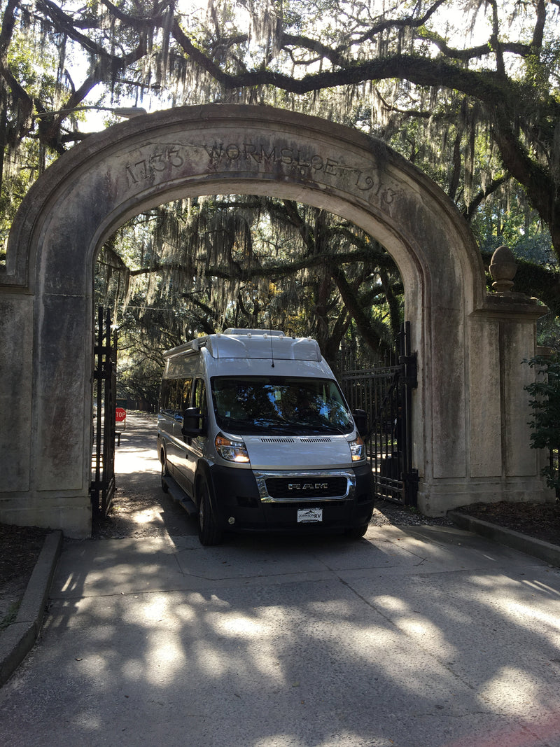 RV rental under historic Wormsloe archway, flanked by moss-draped oaks. — photo 1