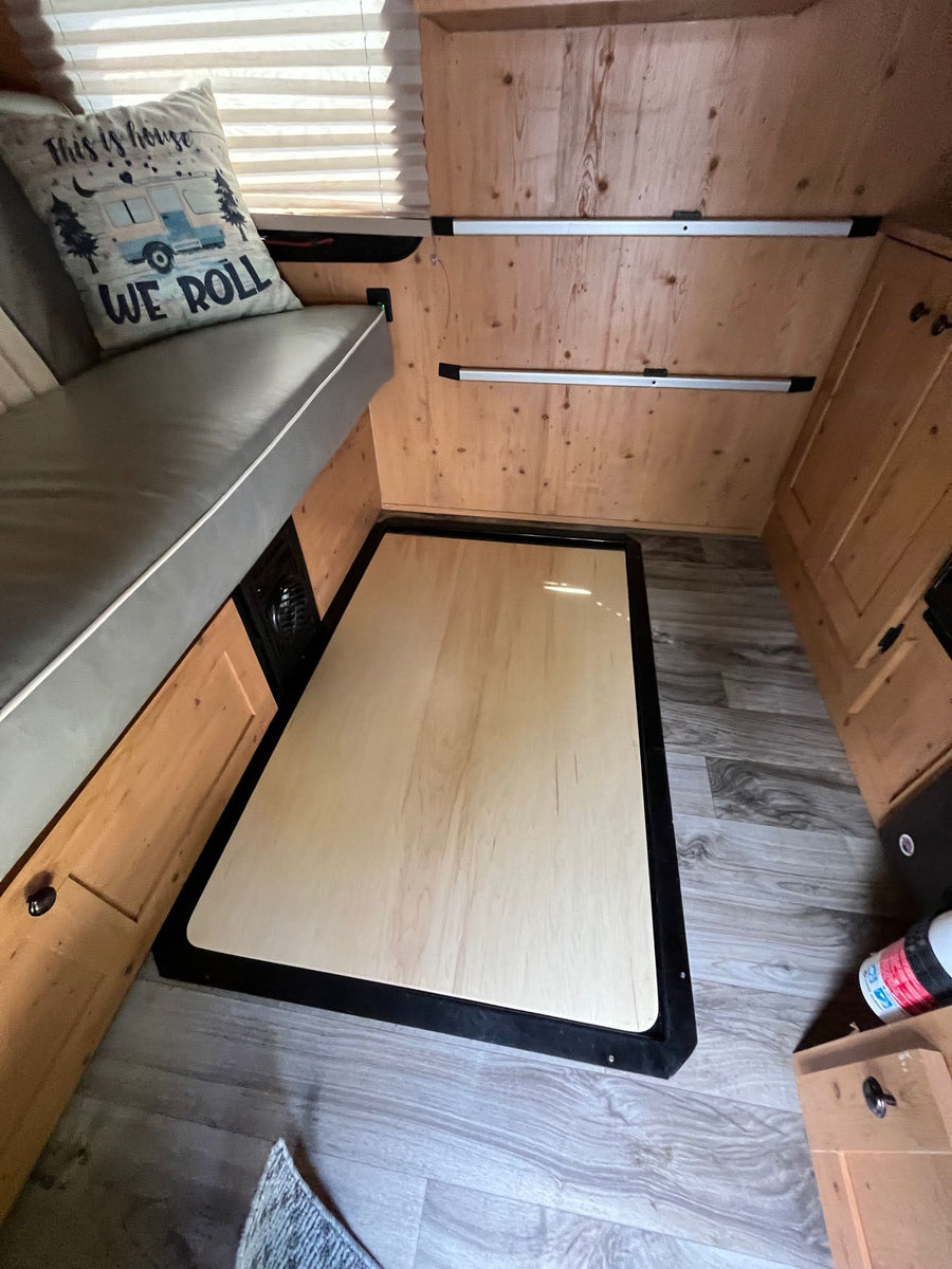  and carpeted floor.|Cozy RV rental interior with wooden walls