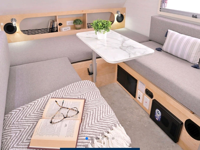  ready for adventure.|This RV rental interior features a convertible bed with slat base — photo 4