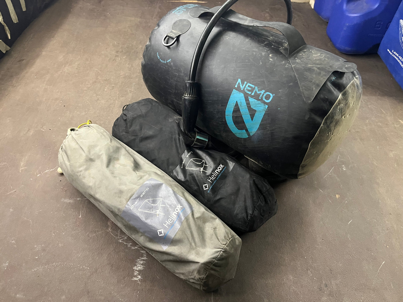 Camping gear for RV rental: Nemo portable shower and two Helinox Chair Zero chairs. Ready for adventure!