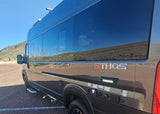 Modern Ethos RV rental with utility hookups parked in a sunny desert landscape, reflecting mountains.