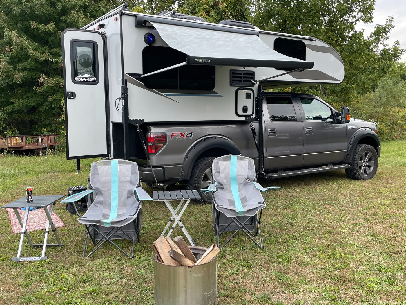 and a colorful rug.|Compact rv rental kitchen: a modern galley with a two-burner stove — photo 10