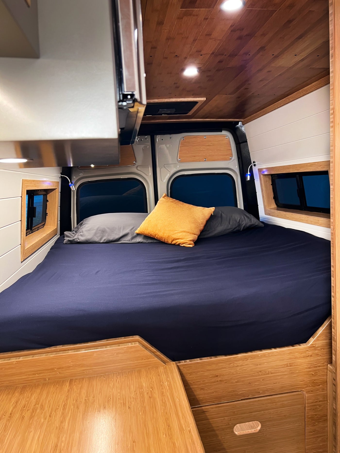  featuring bright overhead lighting.|RV rental kitchen features an open microwave — photo 15
