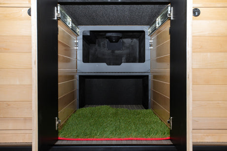 RV rental: Dedicated pet space with artificial grass mat, offering a built-in relief area with ventilation.