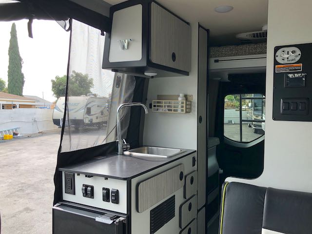  parked on asphalt.|View of a modern Mercedes RV rental interior dashboard — photo 7
