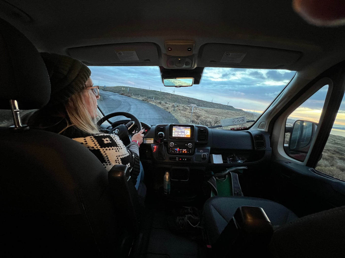  a bearded traveler watches wind turbines — photo 9