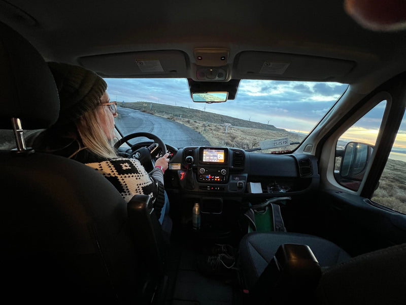  a bearded traveler watches wind turbines — photo 9