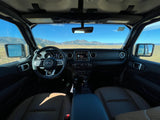 Jeep interior with mountain view, ready for adventure. A rugged alternative to an RV rental for scenic drives.