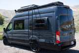 Dark gray Ford Transit camper van, customized for adventure, shown from the rear-side view, ideal for an rv rental experience.