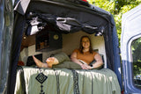  featuring a colorful stripe design. Inside the van