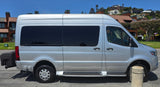 A silver Mercedes Sprinter RV rental with tinted windows and a rear cargo box, ready for adventure.