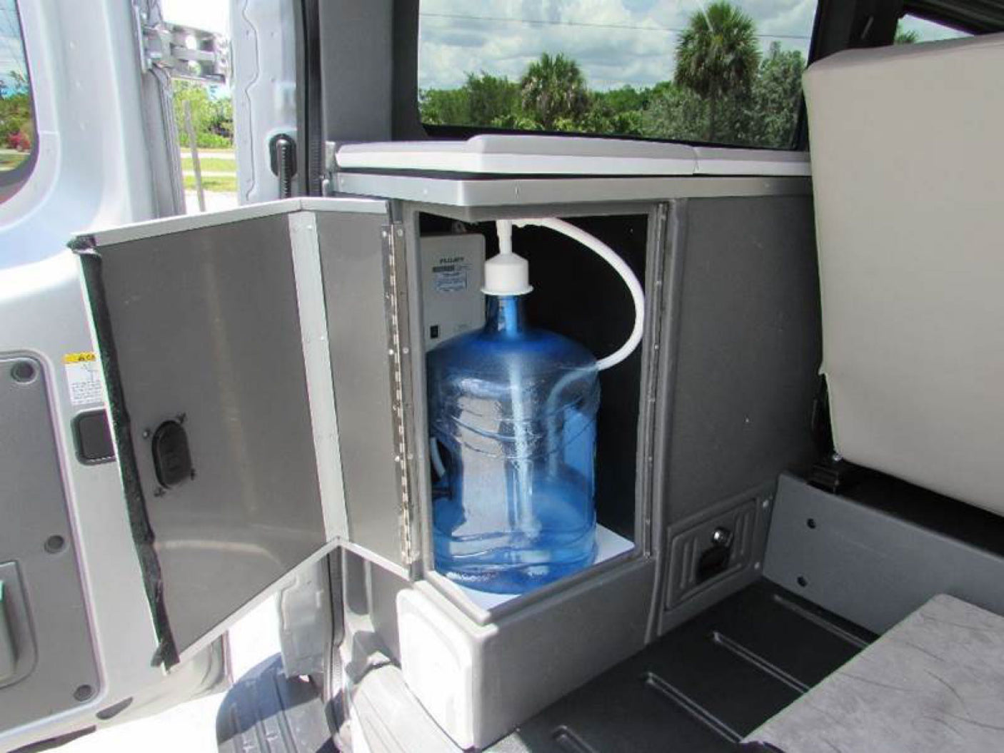  ideal for your next RV rental adventure.|Roadtrek N-6 Active RV rental: a customized silver Nissan NV van with off-road tires