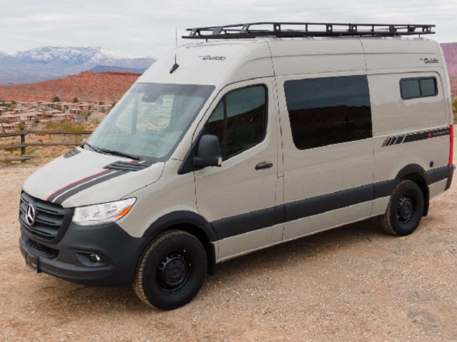  and stunning mountain views. Your mobile adventure awaits!|This RV rental shows its interior with an open side door — photo 10