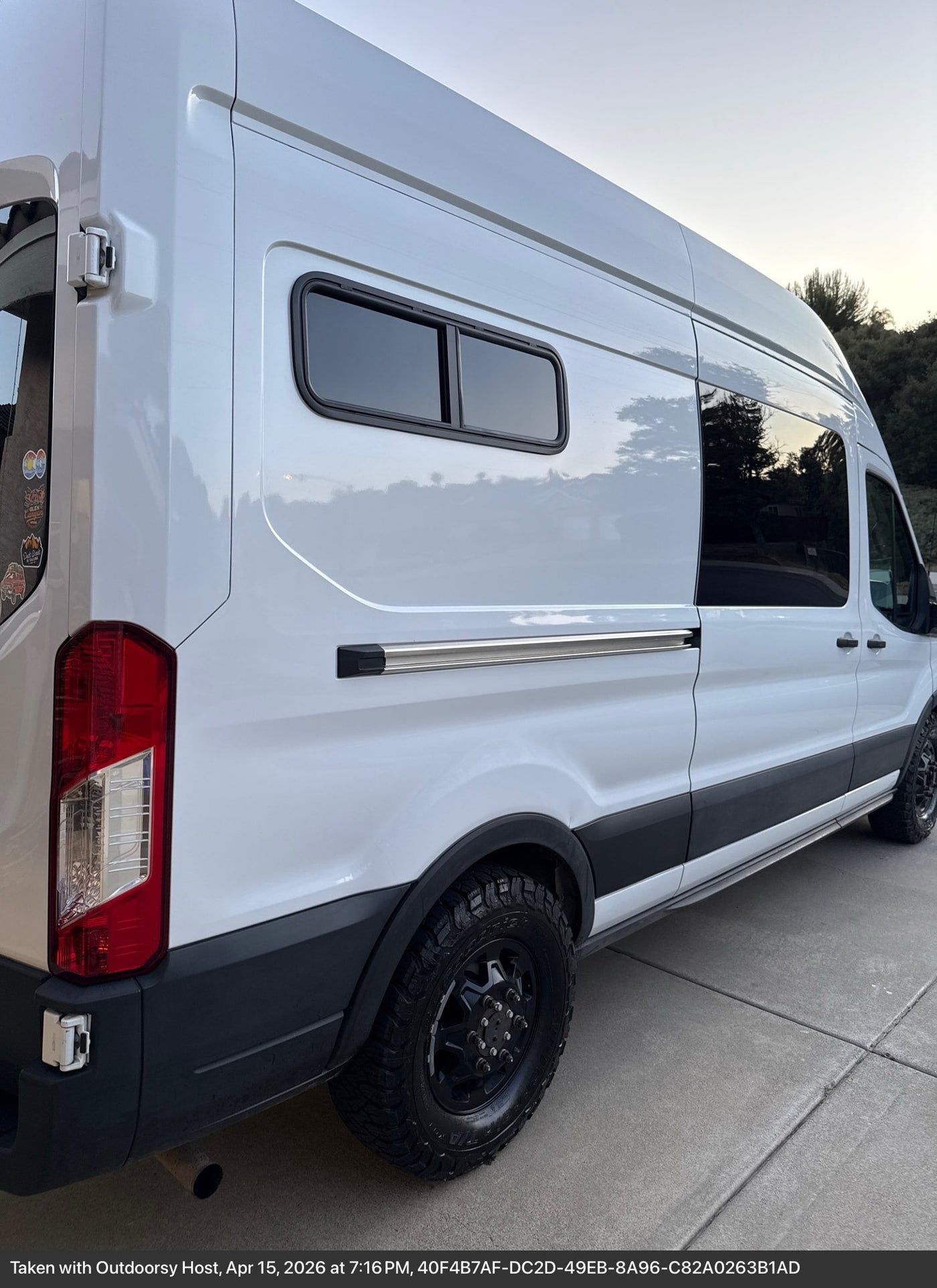  on a custom wooden platform in an rv rental. Essential for off-grid power.|Van conversion RV rental with custom wooden cabinets — photo 13