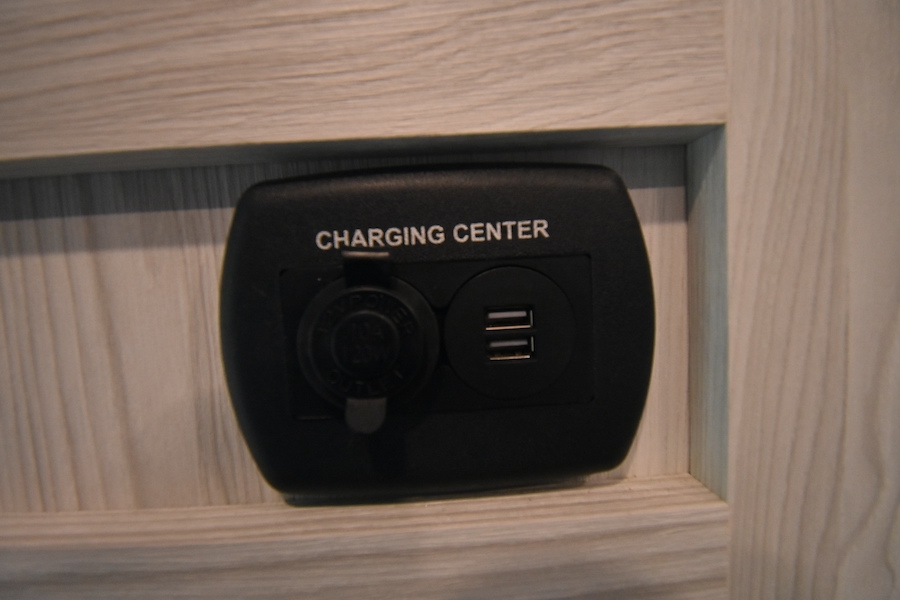RV rental charging center: features a 12V power outlet and two USB ports, ideal for keeping your devices charged.