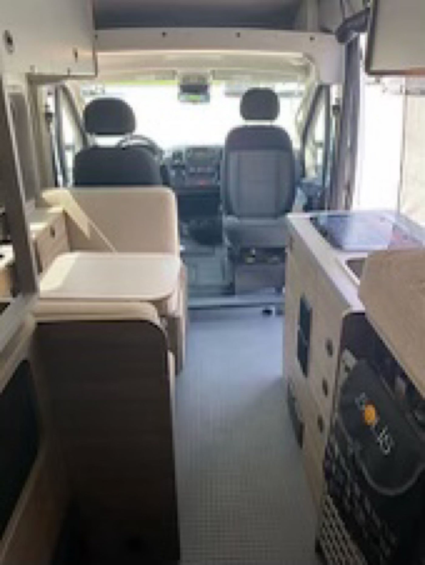  inviting outdoor relaxation.|Comfortable RV rental interior: A cozy bed with white and green bedding — photo 6