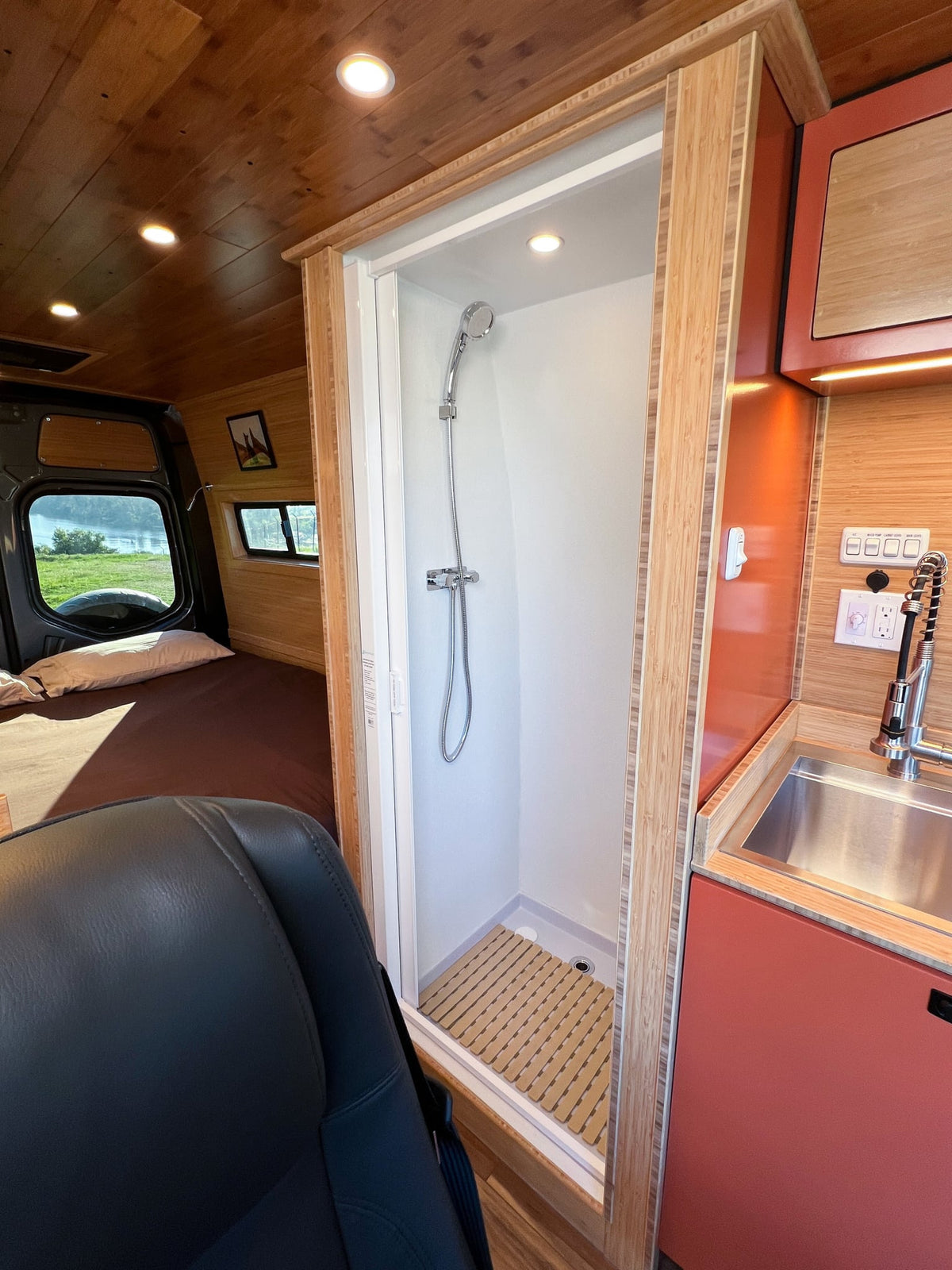  and ambient lighting.|Inside a sophisticated RV rental: modern kitchen — photo 12
