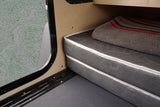  and license plate area on a black textured surface. ALPHA branding visible.|Underside view of an RV rental's robust rear hitch receiver