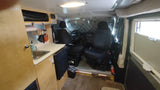 RV rental: Inside a camper van, showing a compact kitchen with sink, front seats, and insulated window covers.