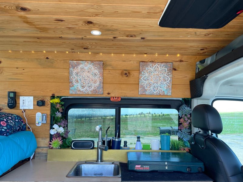  overlooks Boulder Flatirons & green valley. Stunning mountain view.|White camper van RV rental with open side door revealing a wood-paneled — photo 8