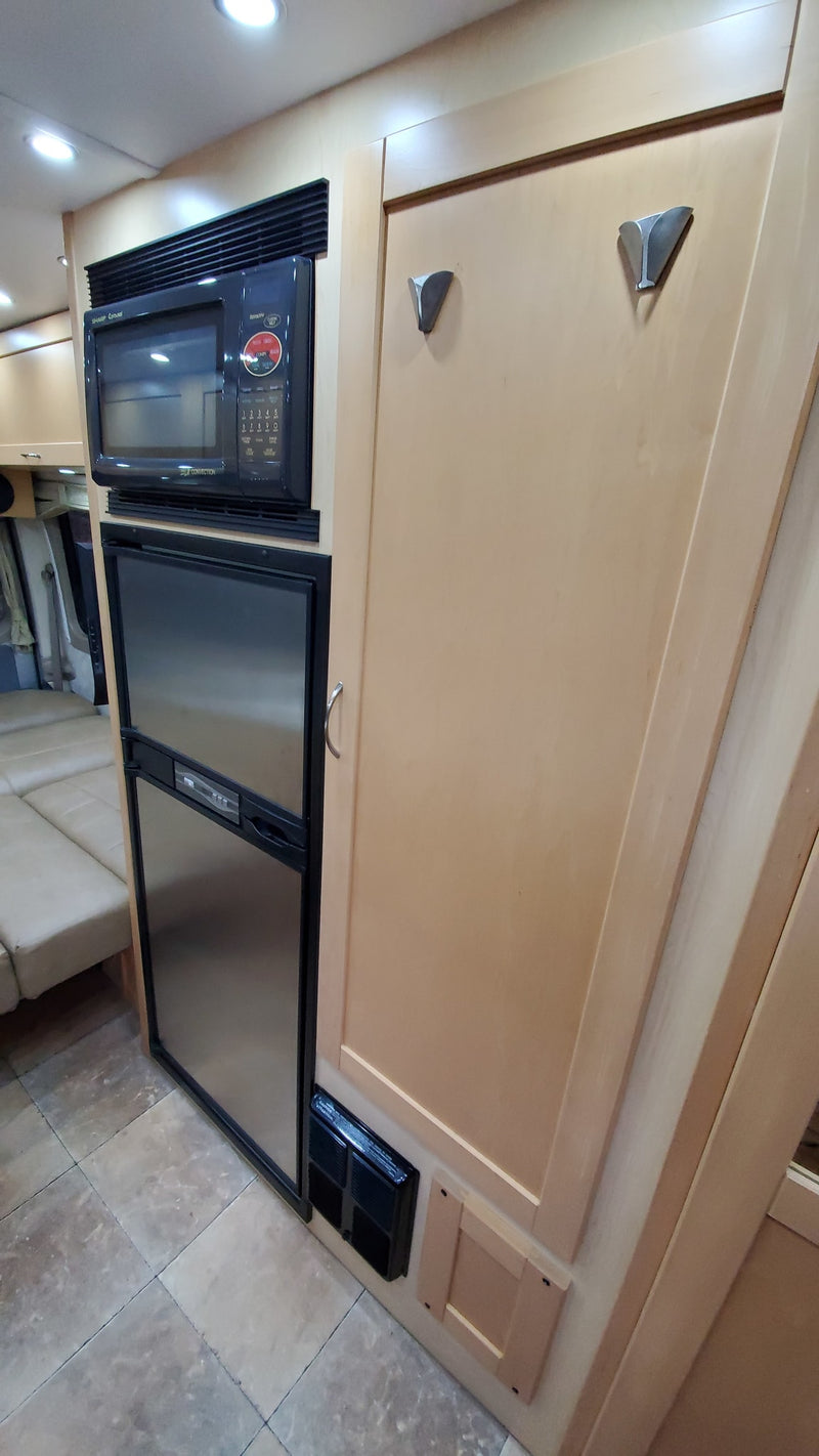  discover a compact kitchen featuring a sink — photo 13