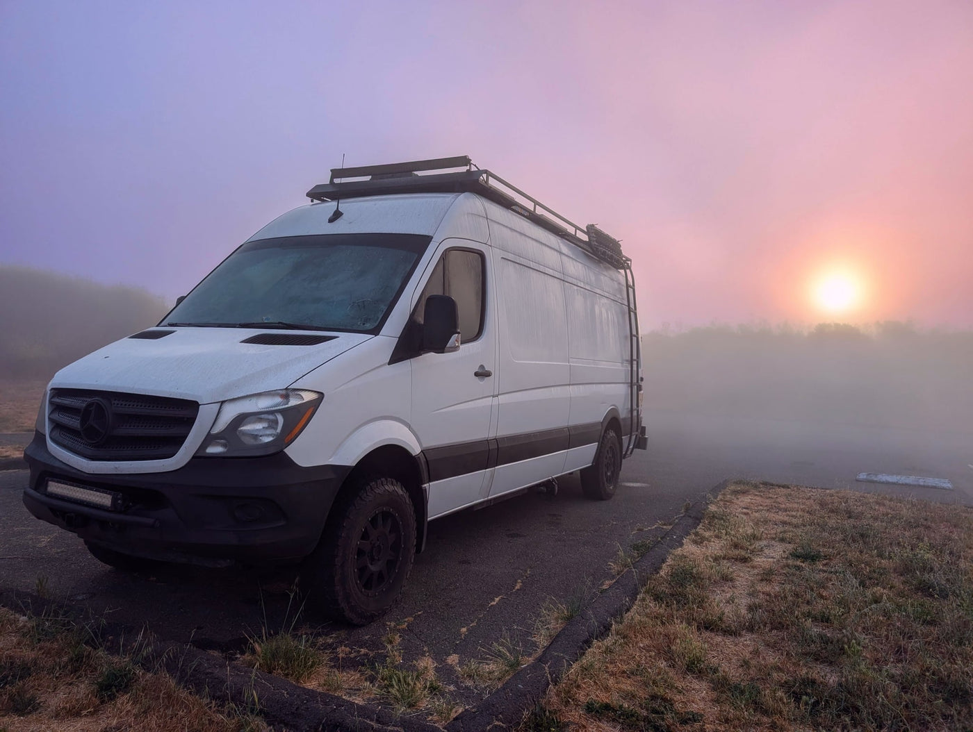  and driver's cabin seats with blue pillows.|Compact RV rental kitchen & full shower. This efficient layout offers comfort for your mobile adventures.|RV rental interior blueprint: functional layout with bed — photo 13