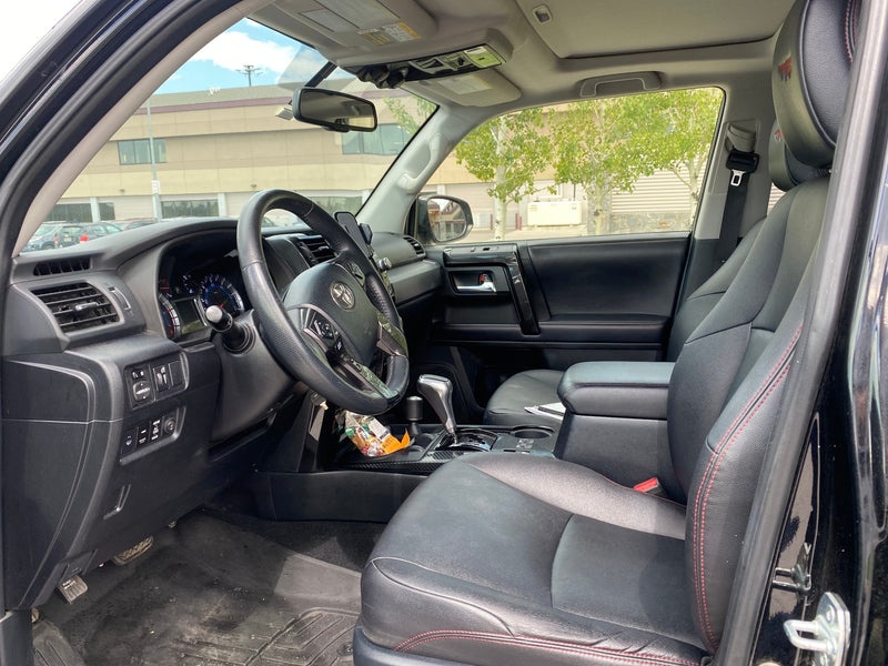 The spacious interior of a vehicle, an ideal choice for an RV rental. Shows black leather seats, steering wheel, and dashboard. — photo 18