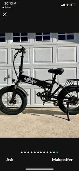 Black foldable AIEL EC AF7 electric fat tire bike, ideal for RV rental adventures or compact storage.