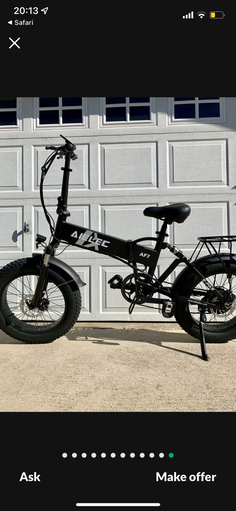Black foldable AIEL EC AF7 electric fat tire bike, ideal for RV rental adventures or compact storage.