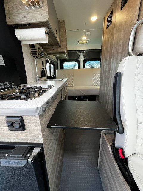  and window.|Inside this modern RV rental: Swivel front seats — photo 13