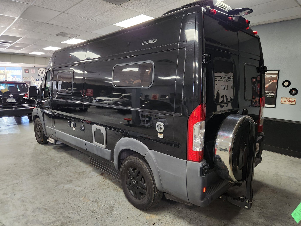  and mirrored microwave. Perfect for travel.|RV rental: View inside a camper van showing front swivel seats — photo 12