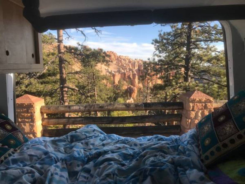  showcasing a personalized campervan setup.|Compact RV rental interior featuring a kitchen with sink/stove — photo 6