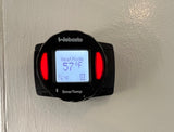 A Webasto SmarTemp thermostat in an RV rental shows Heat Mode at 57°F, set to 76°F, providing cabin temperature control.