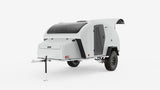 This sleek white teardrop off-road camper, perfect for an RV rental, features a large skylight and rugged tires for adventure.