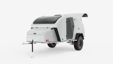 This sleek white teardrop off-road camper, perfect for an RV rental, features a large skylight and rugged tires for adventure.